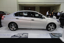 My Auto Fest 2016: Peugeot previews the new 408 e-THP sedan at the NAZA Group display with other Peugeot, Kia and Citroen cars