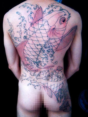 Big transparent koi fish tattoo on a man's back.