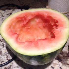 half of a scooped out watermelon
