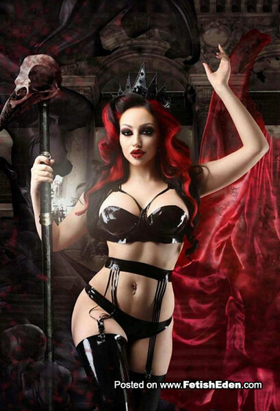 Redhead Dani Divine sorceress in black latex lingerie