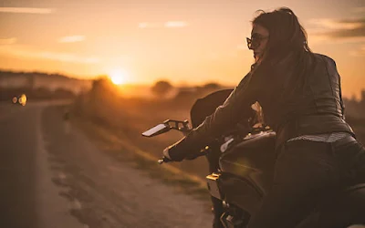 female-biker-at-dusk Women Motorcyclist