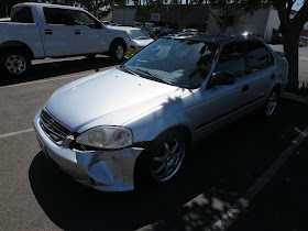 Dented Civic before collision repairs at Almost Everything Auto Body