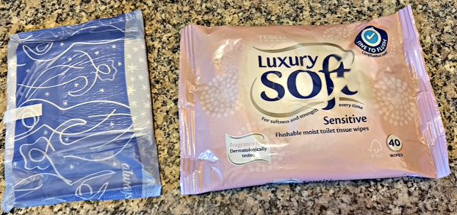 A sanitary pad and flushable wipes.