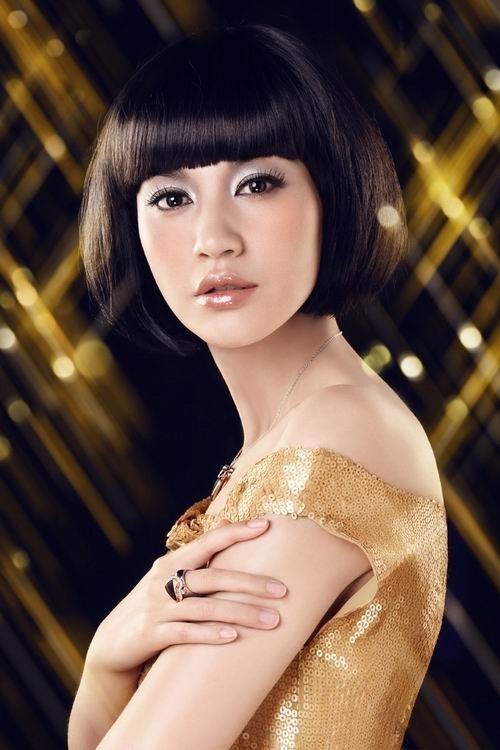 Use a hairspray to hold this look. Trendy black medium blunt bob hairstyle 