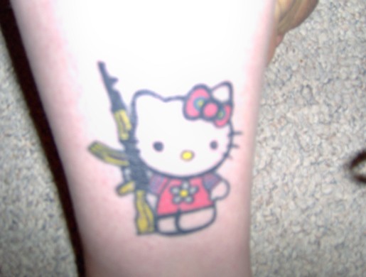 Isn't playing with guns, no no, leave the AK-47 for Hello Kitty!