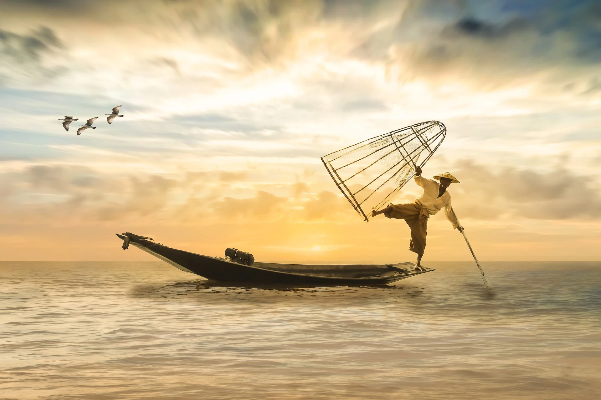A man gracefully balancing on a small boat, attempting to fish with one hand while holding a basket, exemplifying the balance of life's elements.