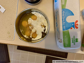 photo of eggs and milk in a bowl, ready to be whisked together