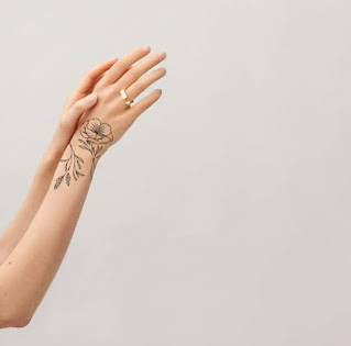 17 Beautiful Simple Line Art Floral Tattoo Designs On Wrist