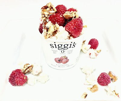 Siggis Raspberry Yogurt with fresh Raspberries, KIND Snacks Nutrition Bar and Jolly Time Popcorn