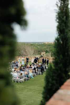 behind the scenes look of guests sitting at the ceremony