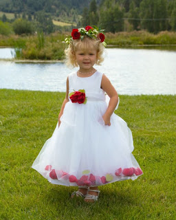 Rose petals sewn in the hem of the flower girl's dress