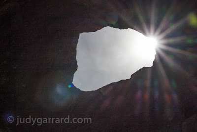 Sun flare thru The Hole in the Rock