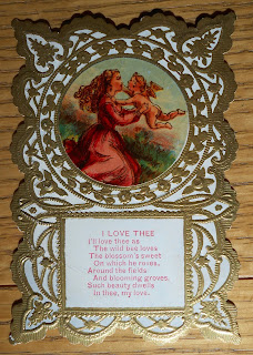 1880s valentine showing a woman and cupid