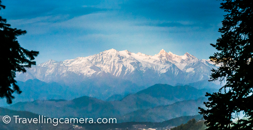 Now that lot of travellers are moving away from typical tourist destinations, people are choosing places like Narkanda and the popularity of such places is increasing fast. Narkanda is located on NH-22 which connects Shimla with Kinnaur and surrounded by snow covered peaks. Beautiful landscapes with snow covered peaks, blue sky and high deodars make this place very special. Narkanda is not only a small town in Himachal, but it's a region which has lot to offer for explorers/travellers.How to reach Narkanda - Narkanda town is 60 kilometers from Shimla and very well accessible through local buses. The road from Shimla to Narkanda is superb except a stretch near Shimla/Sanjauli towns. It takes approximately 1.5 hours from Shimla to Narkanda. If you are driving in your own vehicle, it's recommended to stop at Shilaroo Hockey stadium Dhomri  is closest camping place to Narkanda. It's at a walking distance from the town. First photograph of this Photo Journey is clicked at Dhomri. This was clicked few years back during MTB Himalaya rally . And this is the place where skiing trainings and competitions happen in winters.If we look at Narkanda Pictures on internet, you wold find lot of hikes around Narkanda and Hatu peak  is one of the most popular place amongst hikers, Trekkers, bikers  and adventure lovers. Check out the link above to know about this place. This place is also surrounded by beautiful forests. This place is also quite interesting for camping. Hatu peak is probably the highest peak in this region and it's must to experience the wind on the top.Most of the Narkanda Hotels have great view of snow covered peaks. I have stayed in HPPWD guest house and HPTDC hotel in Narkanda. Both of these properties are very well located around the town.Narkanda tourism is picking up and it's quite encouraging. Most of folks who plan shimla kinnaur trip should definitely consider taking a break around this region of Shimla. As you move further from Narkanda, the landscapes become more beautiful. Road passes through deodar forests and suddenly you come across great views of snow covered peaks Another interesting place around Narkanda is Tani Jubber lake which is close to Kotgarh. It's a beautiful lake surrounded by deodar forest. I was also fortunate to camp at Tani jubber as well. Once, we had installed our tents in playground of government school which is near to Tani Jubber lake. And one night was spent in an apple orchard. If you keep walking on the road adjoining lake, you would find lot of apples. July/August is best time to see red apples on these trees.Kotgarh shimla region is popular for it's export quality apples and cherries. As you enter Kotgarh region, you see apple orchards all around. Apart from apple, you can find cherries, kiwi, apricot, peach, wallnut, almond trees as well. There are some nice home stays in Kotgarh region. I have never stayed in homestays of Kotgarh, but that's in my list. And I want to visit this region again in July time, which is harvest season for villagers.If you keep driving towards Kinnaur, you hit the place where Satluj will start following you.I am sure that Narkanda has lot more than what I have shared in this post. If you are keen in knowing more, click on links embedded in this post which talk about specific destinations around Narkanda and what makes them so special. Camping is definitely something that should be planned in this part of Himachal Pradesh. Hope to share more camping photographs soon.