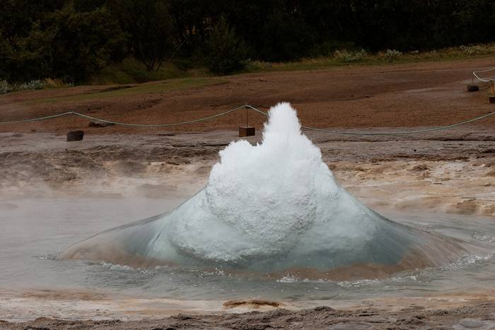 Strokkur (Icelandic for "churn") is a fountain geyser in the geothermal area beside the Hvítá River in Iceland in the southwest part of the country, east of Reykjavík. It is one of Iceland's most famous geysers, erupting about every 4–8 minutes 15 – 20 m high, sometimes up to 40 m high.