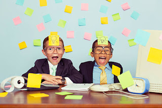 Kids with office supplies brainstorm ideas