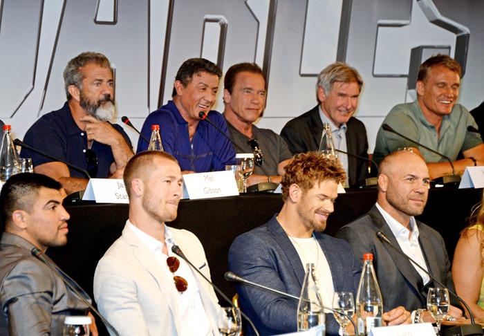 CANNES, FRANCE - MAY 18:  (Back L-R) Mel Gibson, Sylvester Stallone, Arnold Schwarzenegger, Harrison Ford, Dolph Lundgren and (Front L-R) Victor Ortiz, Glen Powell, Kellan Lutz and Randy Couture speak at a photocall for "The Expendables 3" at the Carlton Hotel on May 18, 2014 in Cannes, France.  (Photo by David M. Benett/Getty Images for Millennium Films)