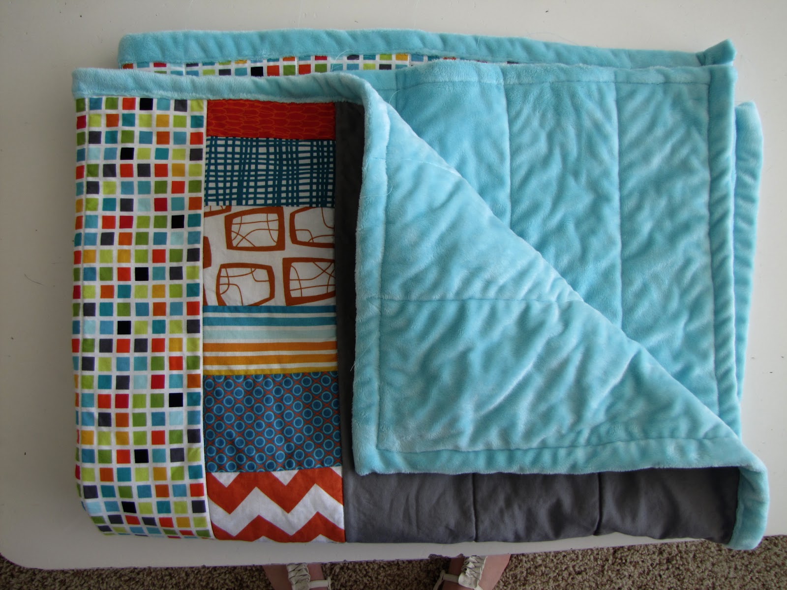 http://snippysisters.blogspot.com/2013/06/minkee-baby-quilt.html