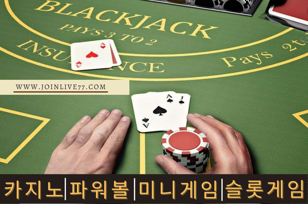 Blackjack table with cards and chips hold by a hand.