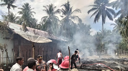 Aksi Sigap Ipda Arizal Bantu Padamkan Kebakaran Rumah Warga