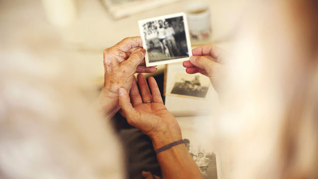 People who are lonely are generally dissatisfied, but they also tend to reflect more on significant events in their lives. Researchers claim that turning to nostalgia, such as these women looking at old photographs, can help people manage during difficult times.   GETTY IMAGES/SHESTOCK PLUS