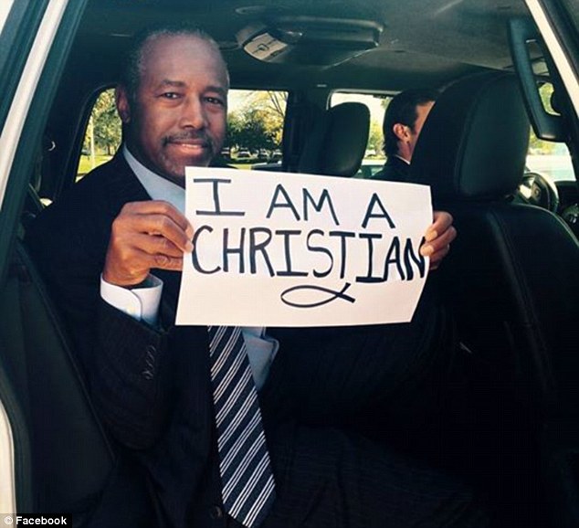 Proud: Ben Carson posted a photo of himself with a sign that read 'I Am A Christian' on Friday