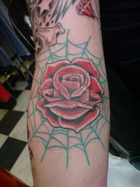 The last of my Spider Web Tattoo Designs is this cool rose tattoo