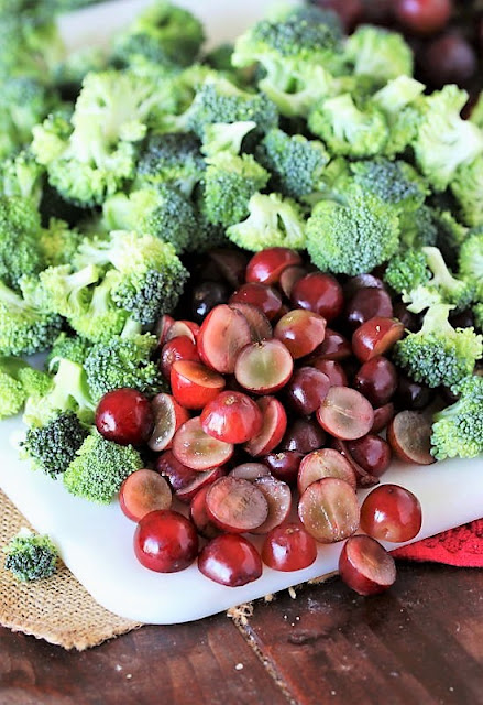 Chopped Broccoli and Halved Red Grapes to Make Broccoli Pasta Salad with Grapes Image