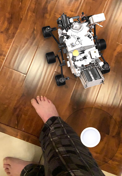 Resident Astronomer, in PJs, drives the Mission to Mars AR app (Source: Palmia Observatory)