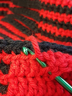Double crochet stitch worked into the front loop only of the stitch two rows below