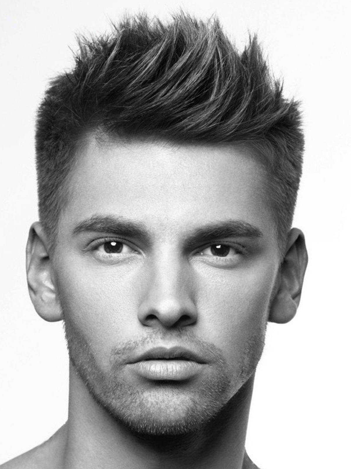 man with curly hair in a messy textured crop