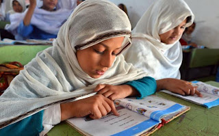 little girl studying in Pakistan