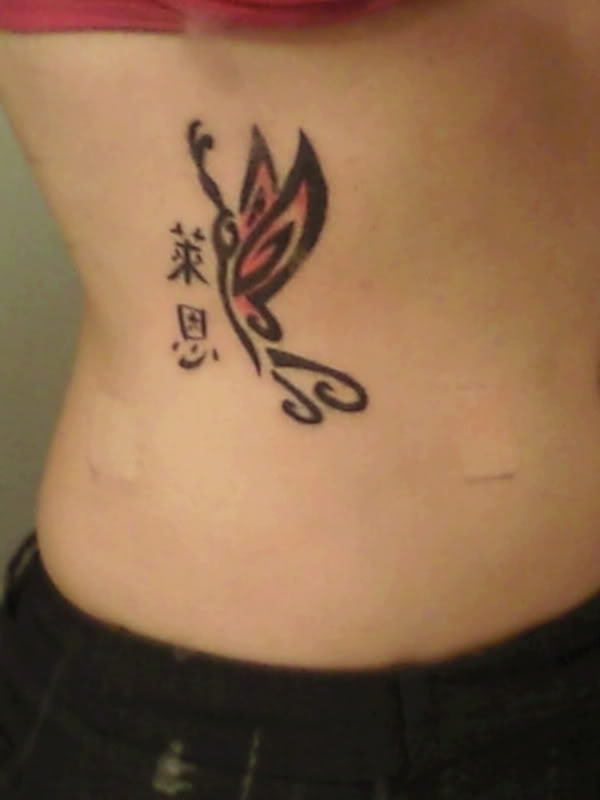 simple butterfly tattoo. lower back utterfly tattoos.