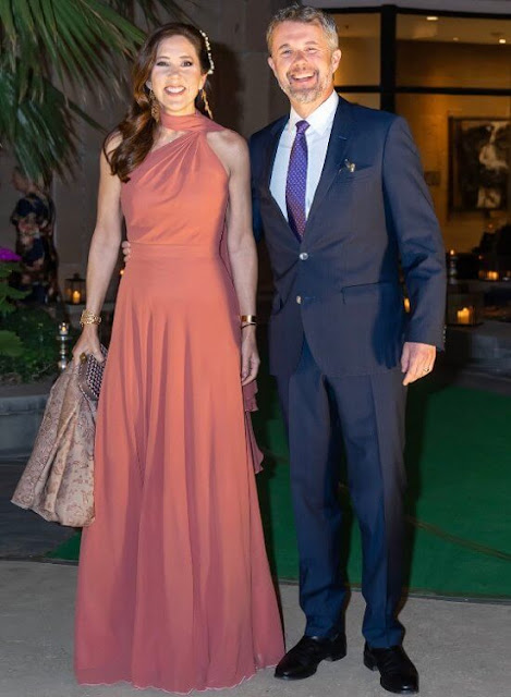 Crown Princess Mary wore a pink bespoke gown by Danish fashion designer Soeren le Schmidt. Brora gold charm earrings