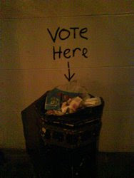 Trash can marked 'vote here'