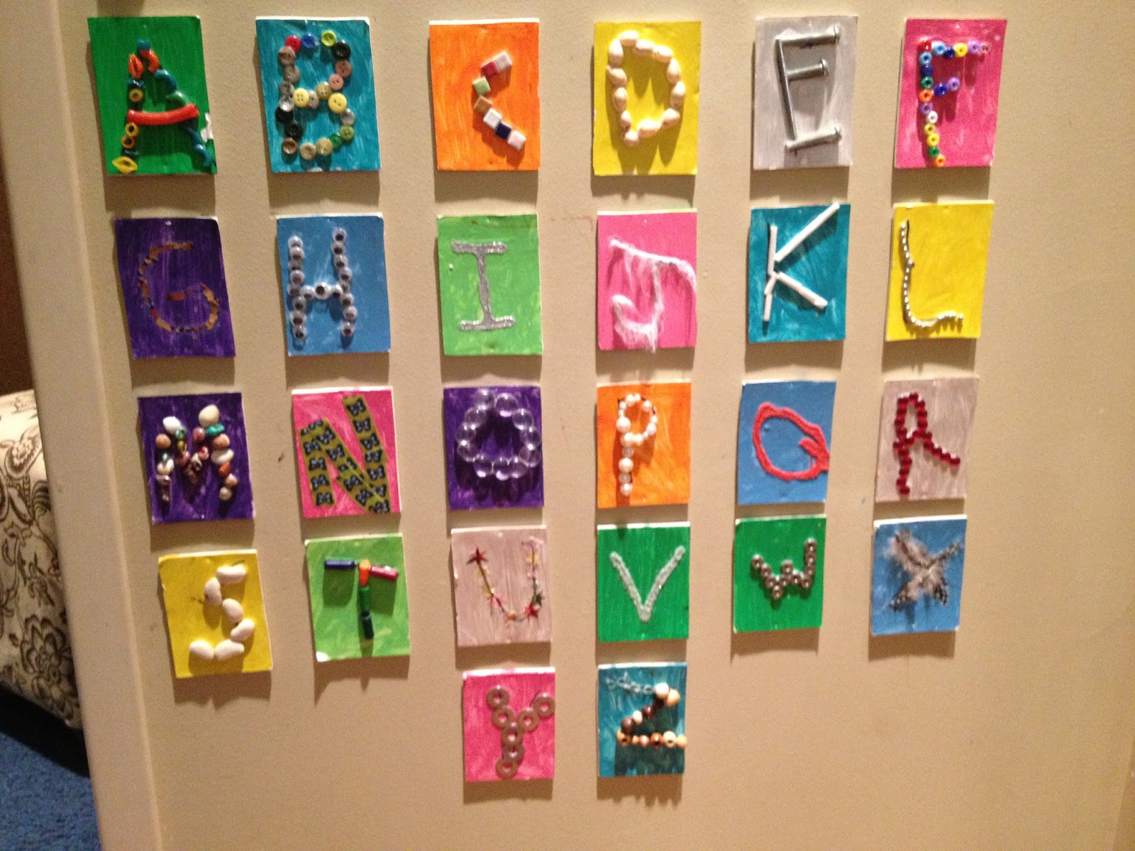 The letters of the alphabet created using found objects and materials ...