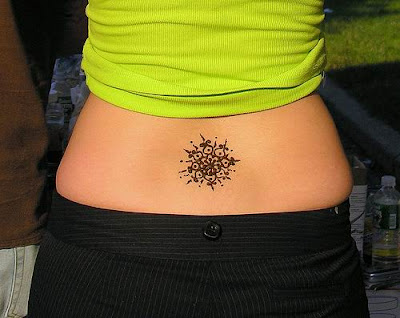 Girl with a very beautiful henna tattoo on her lowerback