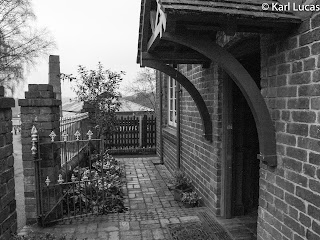 The front door of the Doctors house black+white Blists Hill