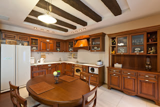 Image of: wood furniture and cabinets in kitchen that reinforces idea that wood needs climate controlled storage.