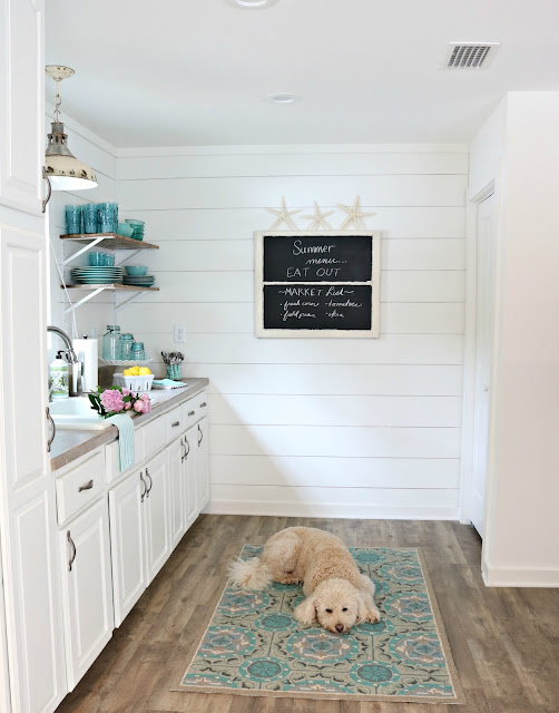 white kitchen with white shiplap 