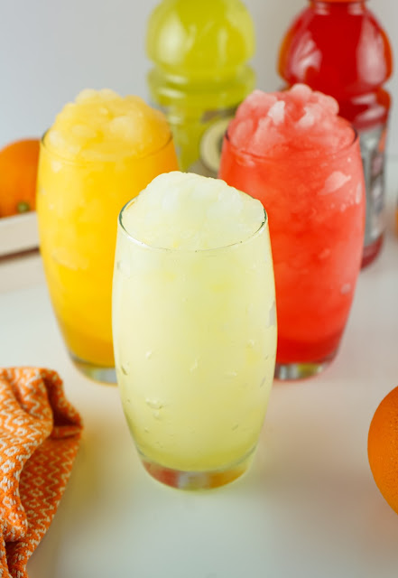 three flavors of slushies in glasses.