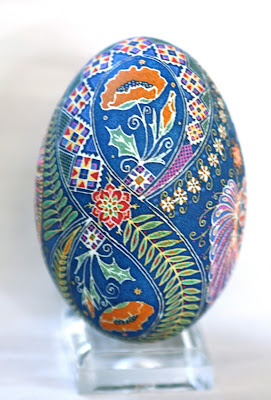 Goose Egg Pysanky with Orange Poppies and Peacocks on Cobalt Blue Background