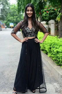 Actress Pooja Hegde Stills in black dress at Valmiki movie Press Meet