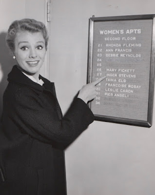 Inger Stevens point to her name on a list of apartments