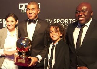 Wilfried Mbappe with his wife Fayza & their sons
