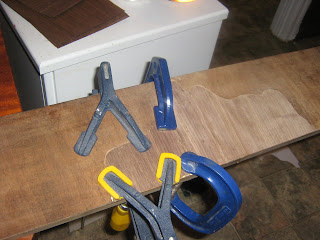 applying a clamp to wood veneer