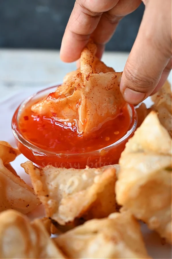 crab rangoon dipped in sweet and sour dipping sauce