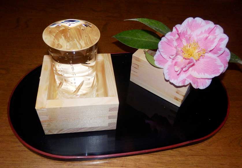 Sake served mokkiri style.