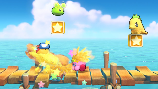 Kirby atacando inimigo com um golpe de areia em Kirby's Return to Dream Land Deluxe