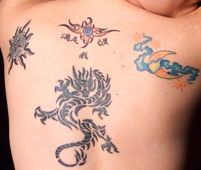 stock vector : Tribal Moon Tattoo Celtic sun, dragons and moon by Takuma